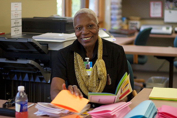 Volunteer folding papers